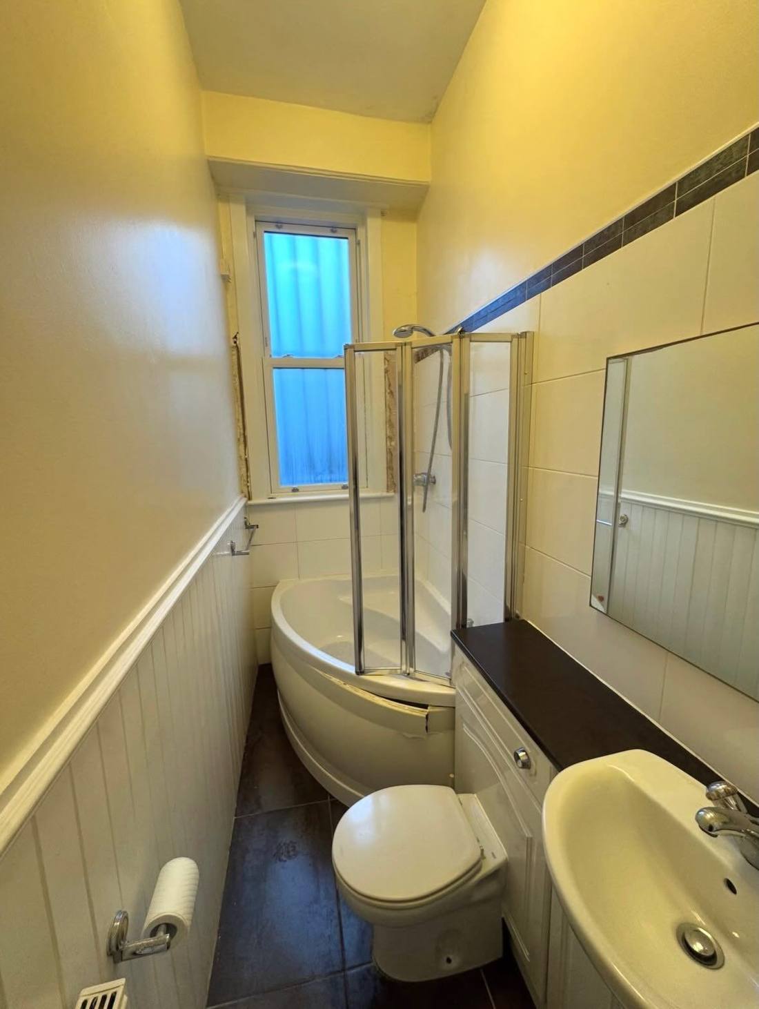 Original bathroom with old coloured suite before the refit