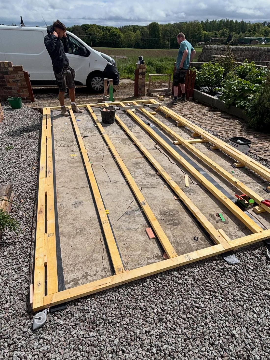 Timber deck frame and joists set out on the ground