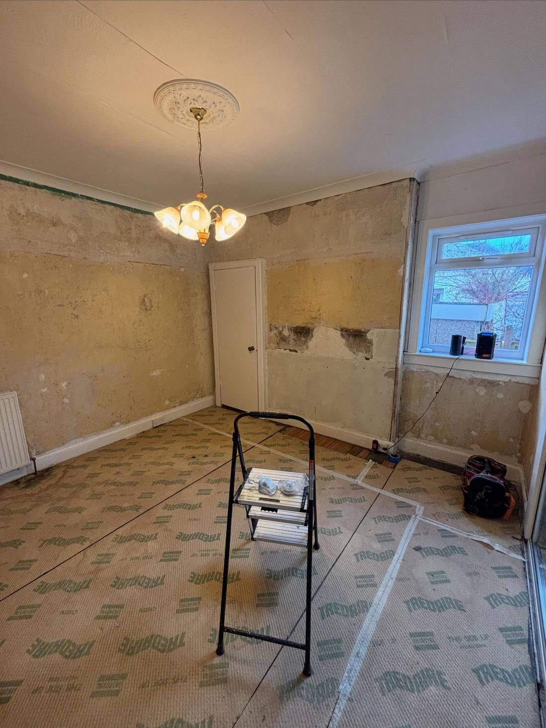 Dining room stripped back to bare plaster