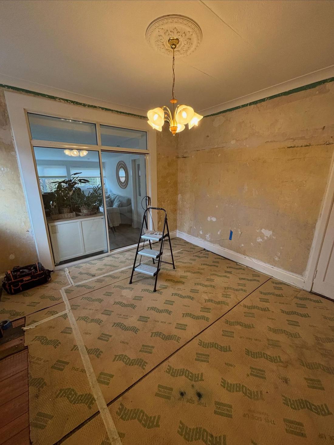 Original dining room with old flooring before the refit
