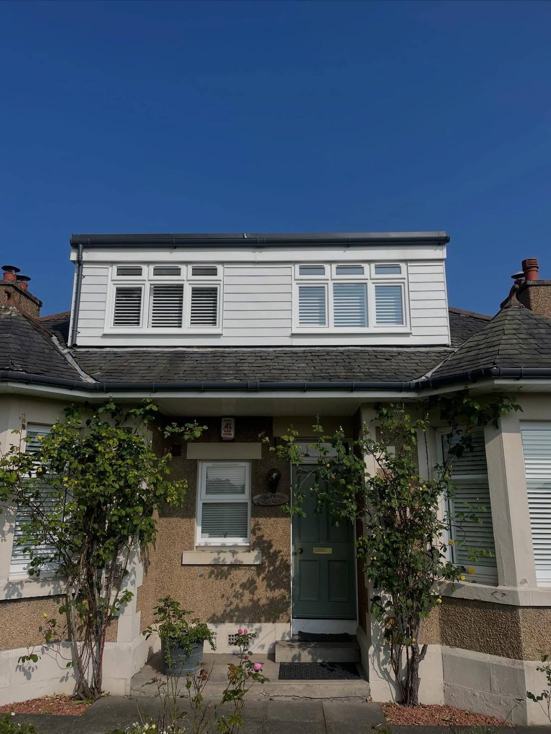 Finished dormer with new white cladding and new windows